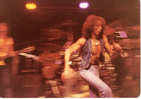 Bon Scott racing across the tiny stage at CBGB's, August 27th, 1977