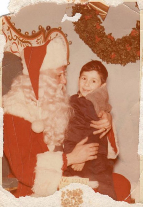A young Johnny Thunders sitting on Santa's lap