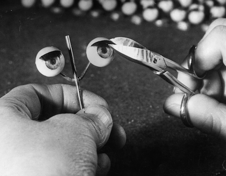 Trimming doll eyelashes, 1949