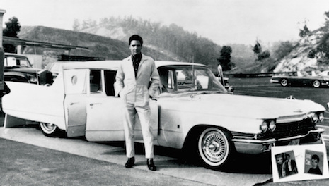 Elvis Presley and his Cadillac limousine by George Barris