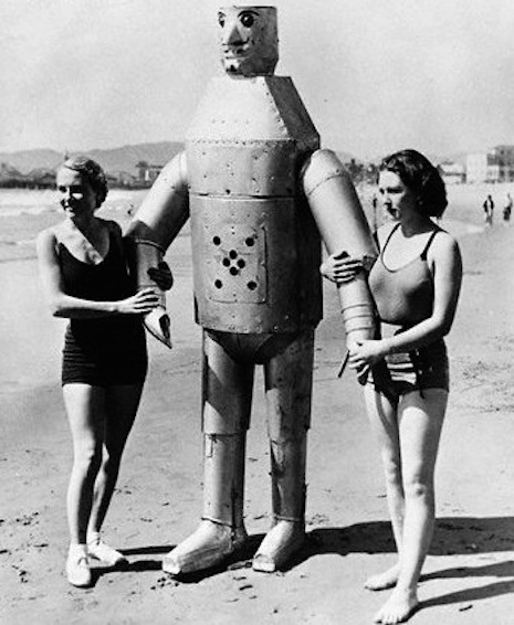 Bathing beauties and a robot hanging out at the beach, 1920s
