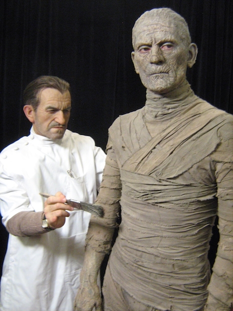 FX artist Jack Pierce putting the finishing touches on Boris Karloff sculpture
