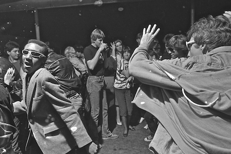 A scenester named Kevin Johnson (in the white glasses) dancing in the crowd at The Island in Houston, Texas 1982
