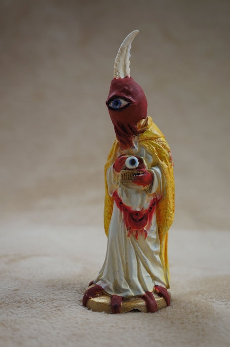 Krampus claw-head, one-eyed nativity scene character