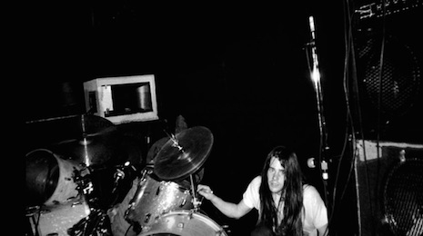 Drummer Chad Channing crawling up to his kit at Man Ray in Cambridge, Massachusetts, April 18th, 1990