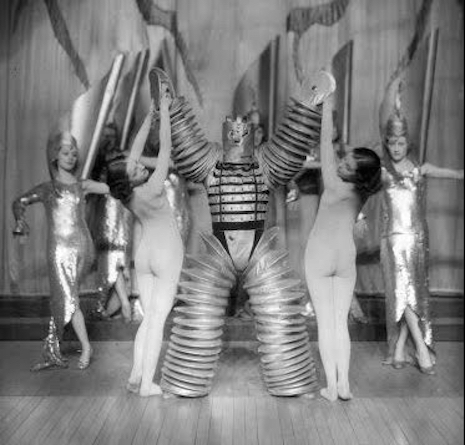 Nude dancers and a robot, 1920s