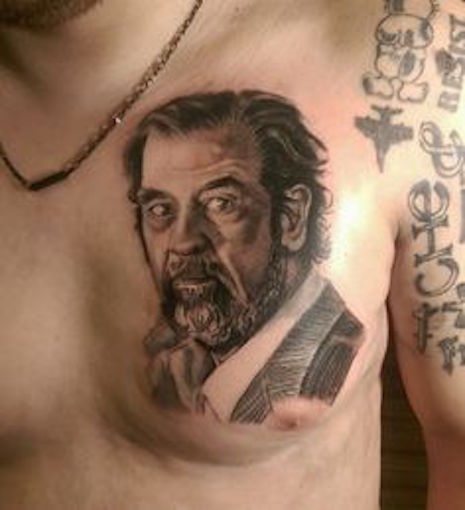 Saddam Hussein portrait tattoo