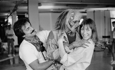 FX master Tom Savini playing around with actress Caroline Williams and one of his gory