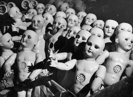 Talking dolls waiting around in a doll factory in France, 1930