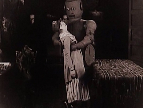 A robot and his female victim in the film, The Master Mystery, 1920