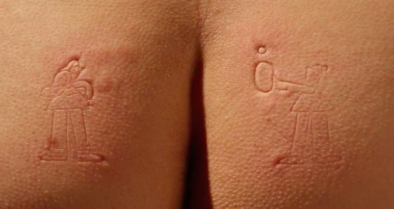 Skin-deep stop-motion animation imprinted on naked human bodies