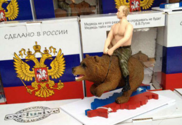 Vladimir Putin rides a bear action figure