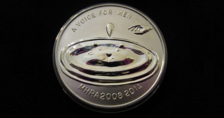 Men’s rights WTF commemorative coin mystery, solved?