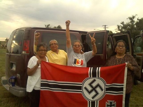 Awesome Native American grandmothers capture and burn white supremacist’s Nazi flag