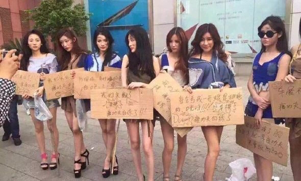 Unemployed Shanghai ‘booth babes’ protest for the right to be sexy on top of cars