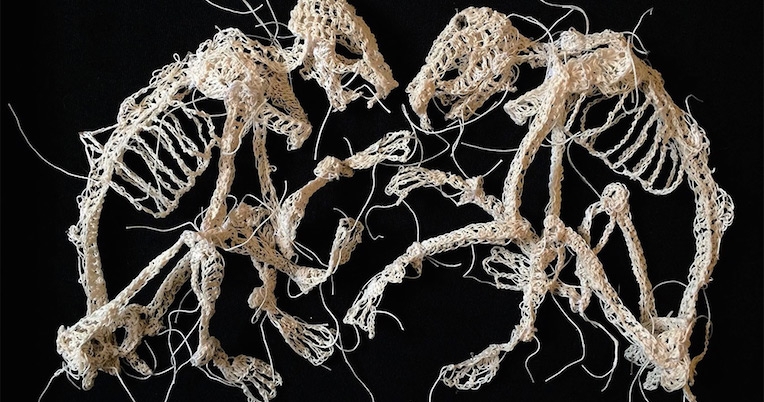 Crocheted animal skeletons show the grim process of death and decay
