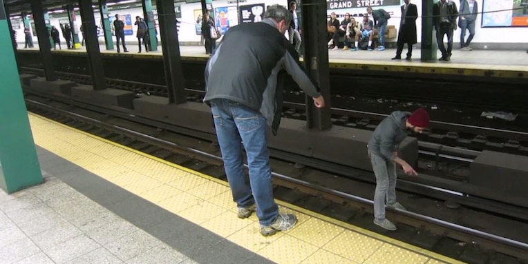 NYC busker jumps on subway tracks, risking his life for a measly five dollars