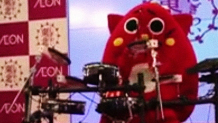 Adorable Japanese mascot drummer plays some serious death metal beats to children’s songs