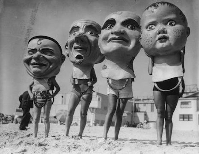 Giant, creepy papier-mâché masks from the Venice Beach Mardi Gras Festival in the mid-1930s