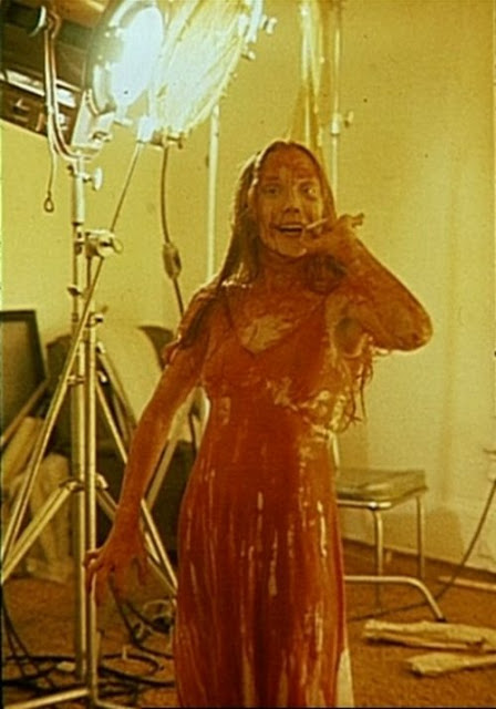 Blood-soaked Sissy Spacek takes a smoke break on the set of ‘Carrie’