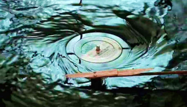 Hypnotic video of a turntable playing disco music underwater