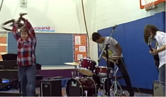 Kid smashes bass during school talent show; stuns audience