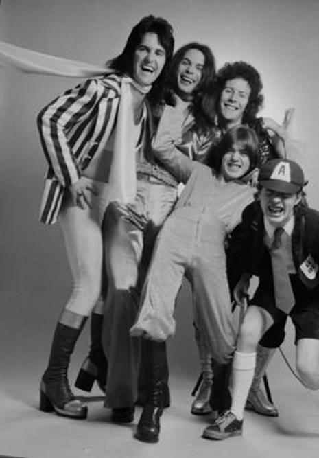 An early version of AC/DC with vocalist Dave Evans looking very glam (far left) with Angus and Malcom Young