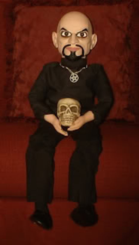 Anton Lavey ventriloquist dummy with pentagram necklace and skull