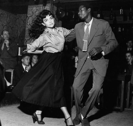 A young Parisian couple dancing to Bebop in the Bebop Cellar at Vieus Colombier