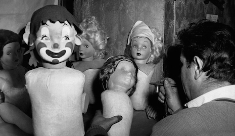 Various, not terrifying at all dolls being painted in a doll factory in Italy, 1950