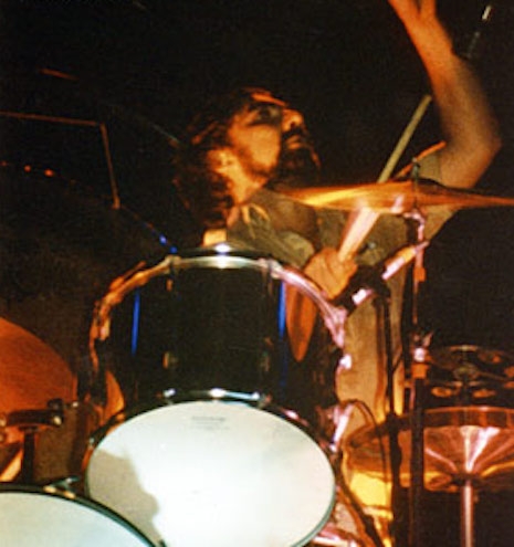Keith Moon sitting behind John Bonham's mythical drum kit, June 23, 1977