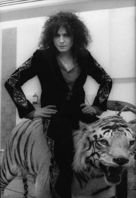 Marc Bolan riding on top of a tiger