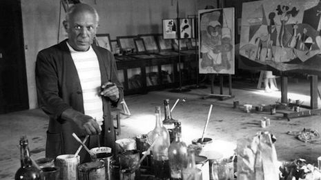 Pablo Picasso in his studio and bottles of Green Fairy