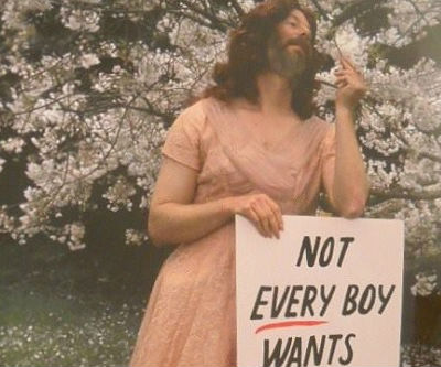 Pretty—and bearded—in pink: Poster boy takes shot at pro-military attitude in gay rights movement