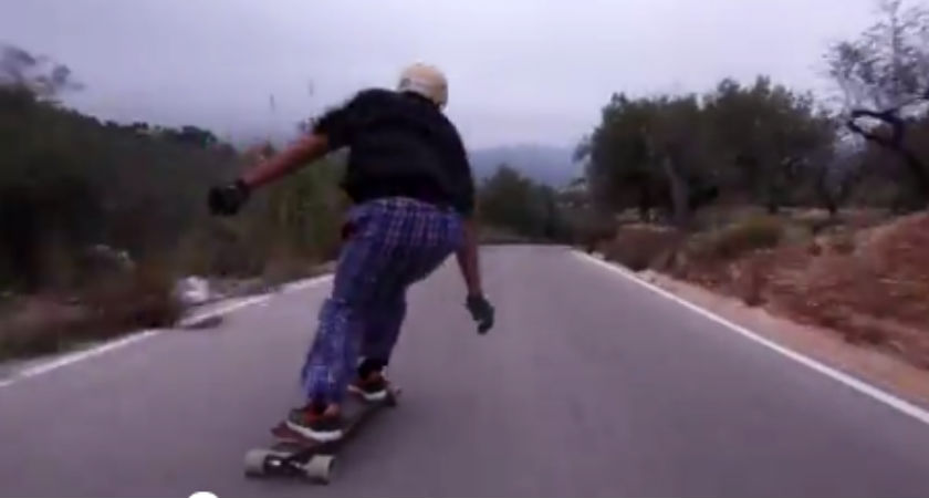 Death defying downhiller nearly skates himself into a bus