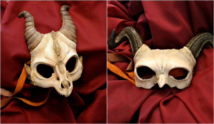 Demonic and dramatic handmade masks of dragons, owls and horned demons