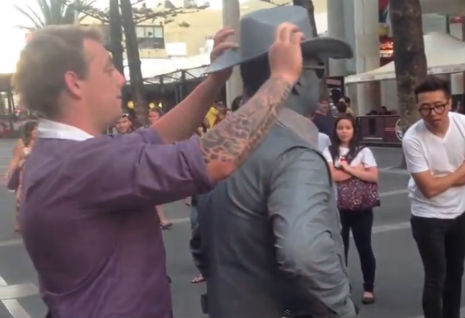 Drunk dumbass gets punched out by street performer