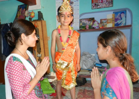 Six-year-old boy with a tail is worshipped as a god